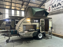 2010 Jurgens Safari Xcape with pop-top tent raised and side kitchen open — used off-road caravan for sale Cape Town (view 2)