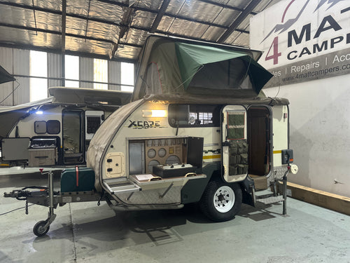 2010 Jurgens Safari Xcape with pop-top tent raised and side kitchen open — used off-road caravan for sale Cape Town (view 2)