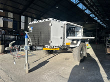 2026 Metalian Genie with side door open showing internal shelving and storage — brand-new off-road camping trailer (view 4)