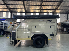 2025 Bush Lapa Miskruier side profile with Bush-Wing 270° awning bag along the roofline — pre-owned off-road caravan (view 5)