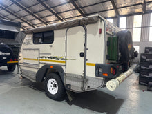 2010 Jurgens Xcape rear view with jerry can and awning-pole storage tube — used off-road caravan for sale (view 6)