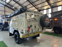 2025 Bush Lapa Miskruier rear view with mounted spare wheel and Bush Lapa cover — used off-road caravan (view 9)
