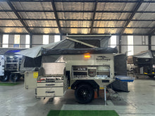2025 Bush Lapa Miskruier slide-out kitchen deployed with gas stove and stainless worktop — 4-sleeper off-road caravan (view 10)
