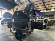 2025 Metalian Genie rear kitchen bay open with fold-down table and storage drawers — kitted pre-owned trailer (view 8)