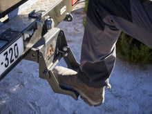Alu-Cab Tow Bar Step folded down behind a vehicle, photo 2