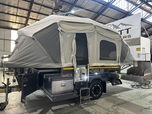 2019 Opus OP4 – set up at camp with the air-beam tent inflated, slide-out kitchen and fridge slide out