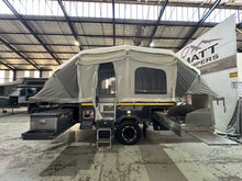 2019 Opus OP4 – tent side with the main door, fold-down step and slide-out kitchen