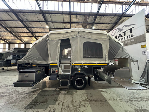 2019 Opus OP4 – tent side with the main door, fold-down step and slide-out kitchen