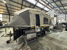 2019 Opus OP4 – front three-quarter view in camp mode with the fridge slide and kitchen extended