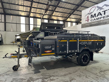 2019 Opus OP4 – packed for travel, front three-quarter view with roof rack and gas bottle brackets