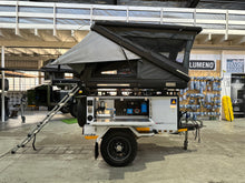 2024 Metalian Genie side view with rooftop tent up and electrical bay open