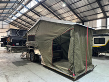 GT Camper fold-out canvas tent with awning and zip-up annex, set up