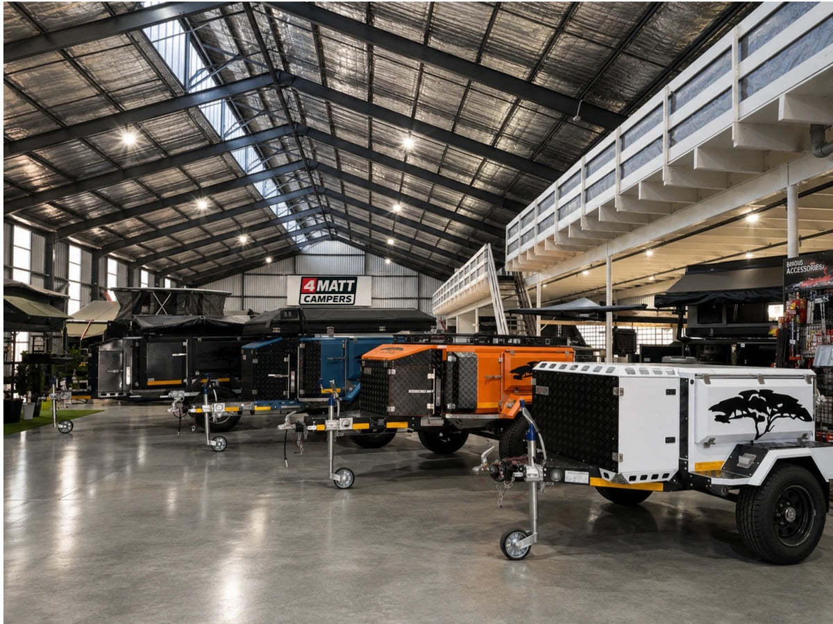 Off-road trailers and campers lined up on the 4Matt Campers showroom floor in Bellville, Cape Town