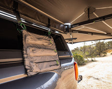 Integrated storage bag hanging from the Deltawing 270° XL Awning arm