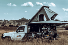Canopy Camper Deluxe on a Land Cruiser 79 single cab, tent and awning open