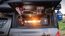 Alu-Cab Canopy Camper side door grid with gas struts