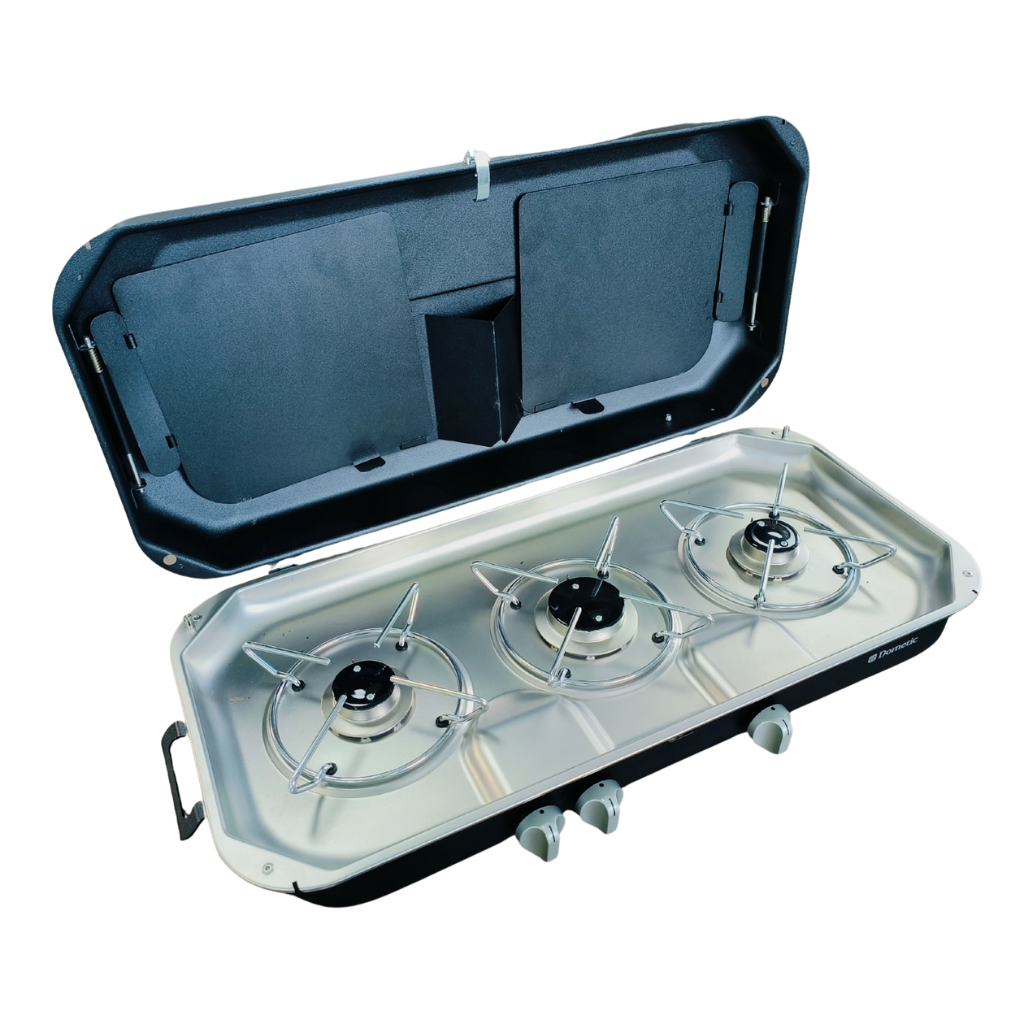 Dometic 3-burner slide-out cook top with hinged lid open, in a stainless-steel housing — 4Matt Campers, Western Cape & Cape Town