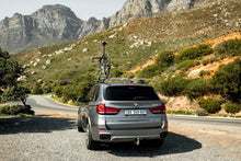 Holdfast Upright Bicycle Holder All-In-One mounted on a roof rack with a bike, photo 6