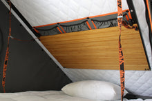 Alu-Cab Interior Roof Drop-Down Table folded down inside a camper, photo 4