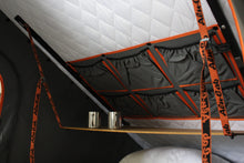 Alu-Cab Interior Roof Drop-Down Table folded down inside a camper, photo 6