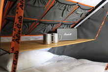 Alu-Cab Interior Roof Drop-Down Table folded down inside a camper