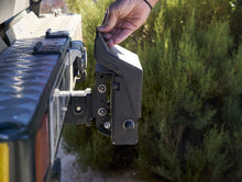 Alu-Cab Tow Bar Step folded down behind a vehicle, photo 4