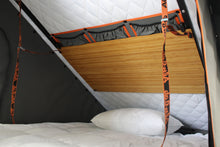 Alu-Cab Interior Roof Drop-Down Table folded down inside a camper, photo 3
