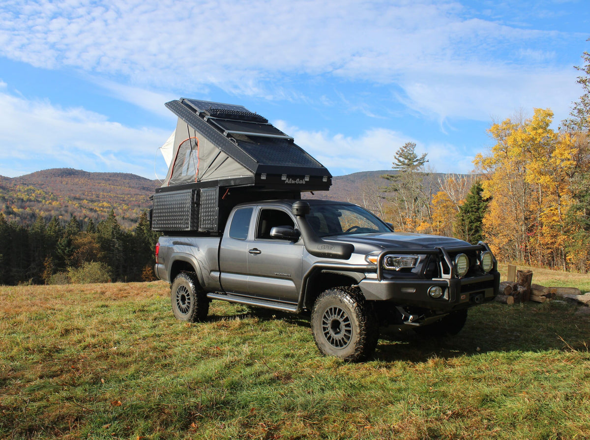 Alu-Cab Khaya Basic camper unit in black on a truck