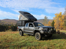 Alu-Cab Khaya Basic camper unit in black on a truck
