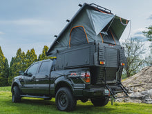 Alu-Cab Khaya Basic camper unit in black on a truck, photo 2