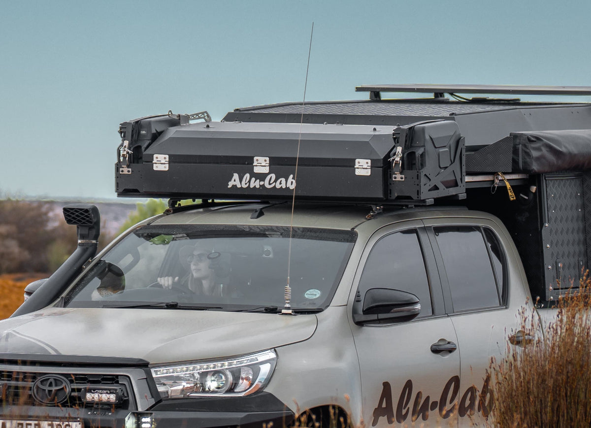 Alu-Cab Roof Box Small (The Escape) mounted on a roof rack