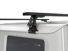 Alu-Cab Wide Gutter Feet clamped onto a vehicle gutter, photo 3