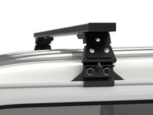 Alu-Cab Wide Gutter Feet clamped onto a vehicle gutter, photo 2