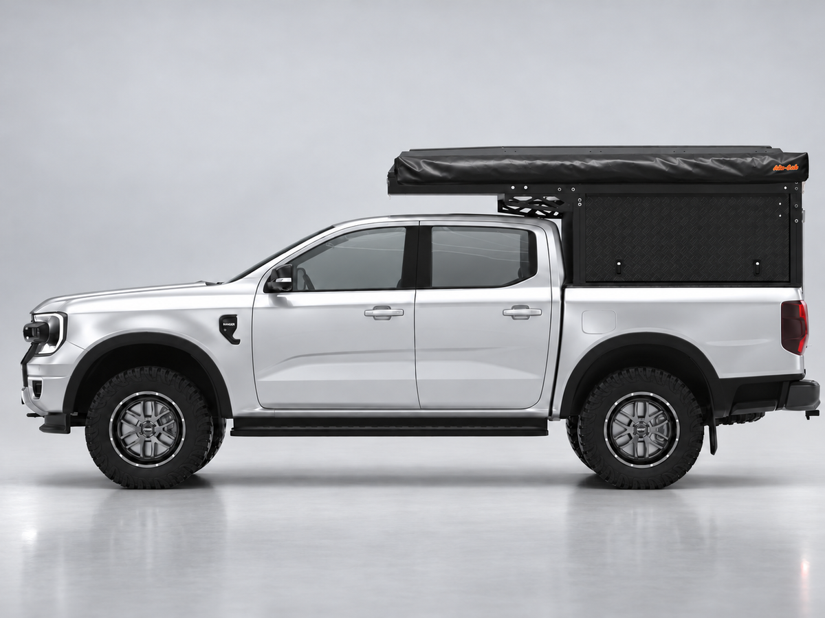 Alu-Cab Canopy Camper Deluxe on a Ford Ranger double cab with Shadow Awning, side view