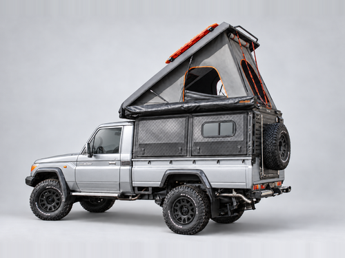 Alu-Cab Canopy Camper Deluxe on a Toyota Land Cruiser 79 single cab, tent open