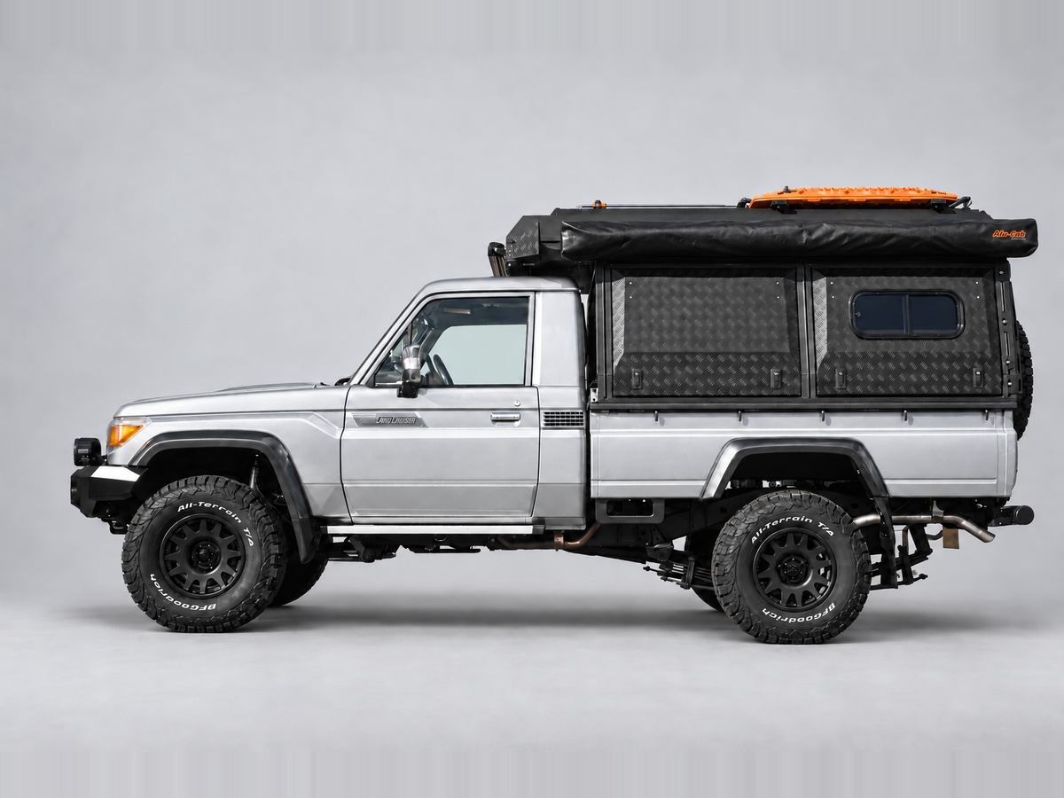 Alu-Cab Canopy Camper Deluxe on a Toyota Land Cruiser 79 single cab, side view