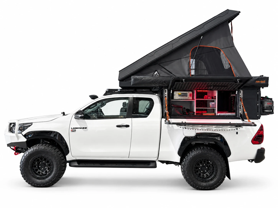 Alu-Cab Canopy Camper Deluxe on a Toyota Hilux Extra Cab, tent open with rear kitchen, side view