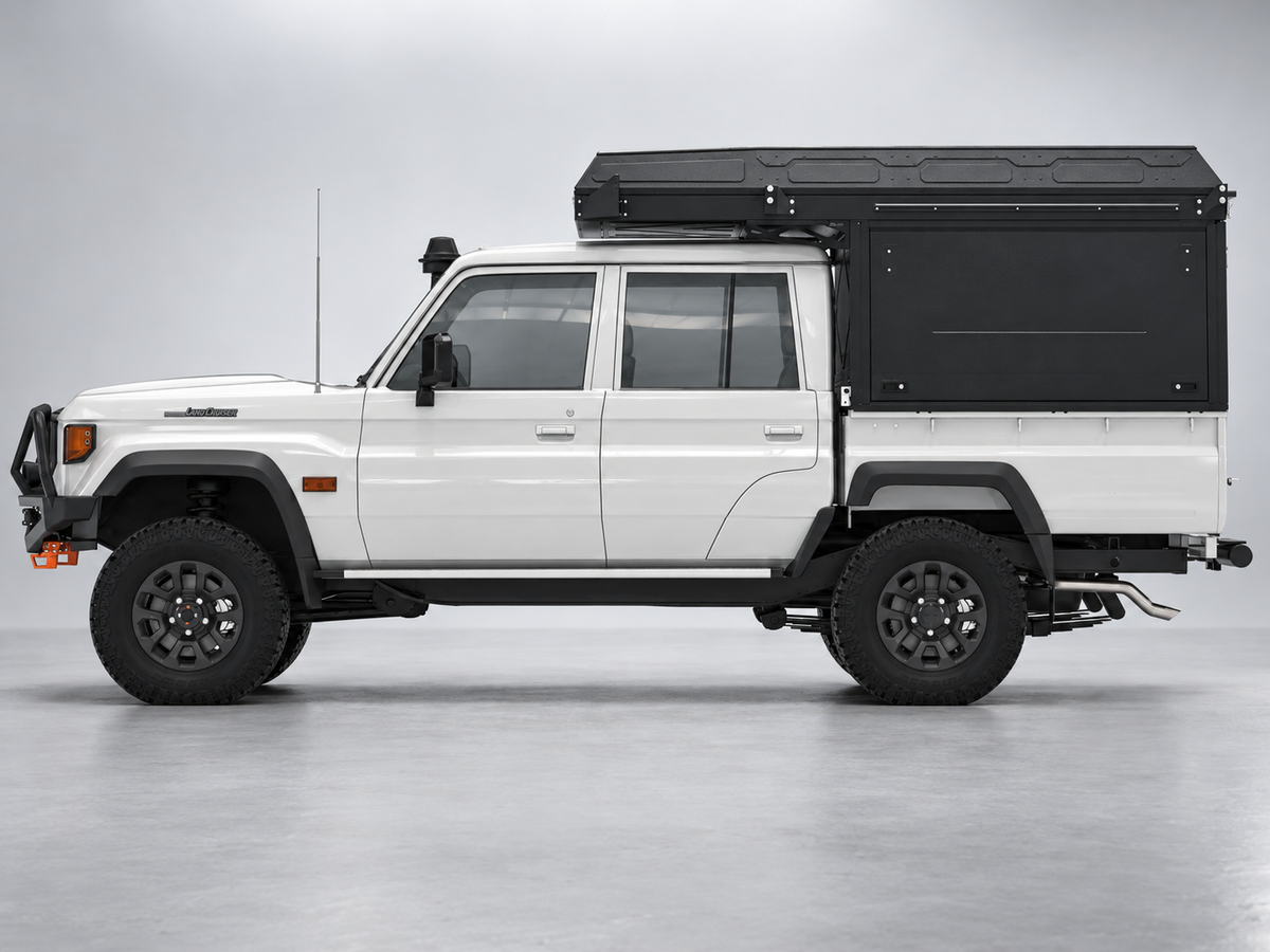 Alu-Cab ModCAP with 2-sleeper Camper Tent on a Toyota Land Cruiser 79 double cab, side view