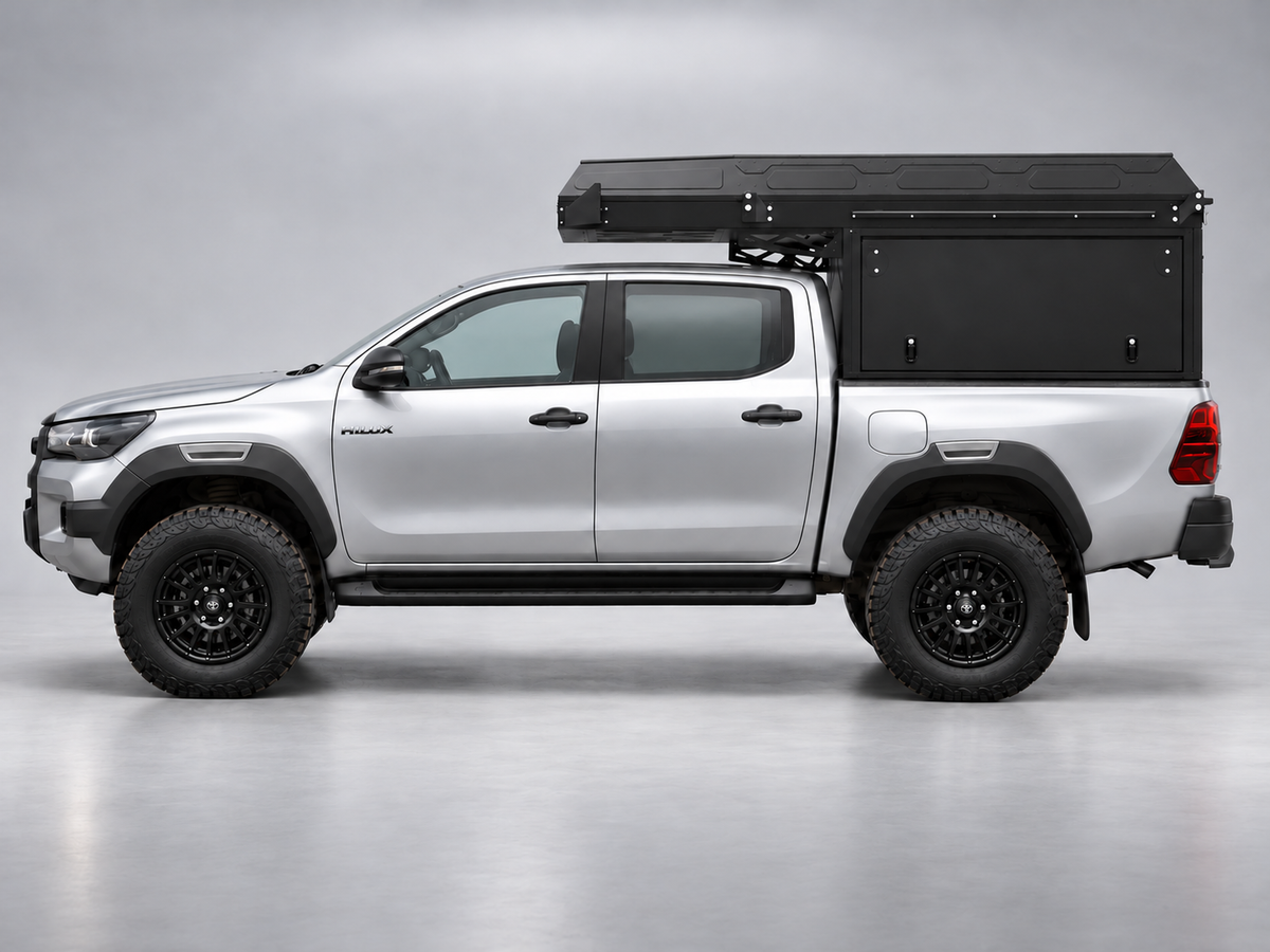 Alu-Cab ModCAP with 2-sleeper Camper Tent on a Toyota Hilux double cab, side view