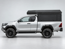 Alu-Cab ModCAP with 2-sleeper Camper Tent on a Toyota Hilux extra cab, side view
