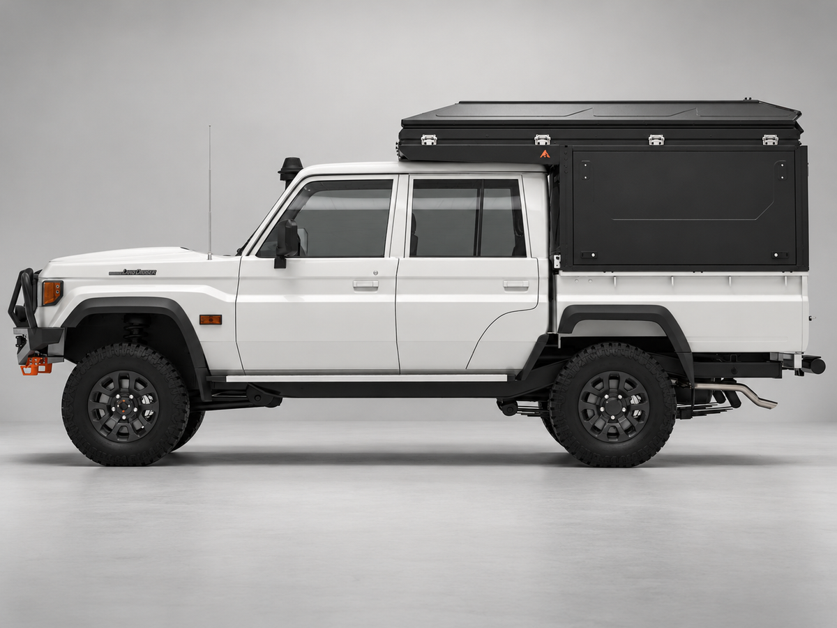 Alu-Cab ModCAP with 4-sleeper Family Camper Tent on a Toyota Land Cruiser 79 double cab, side view