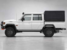 Alu-Cab ModCAP base with flat roof on a Toyota Land Cruiser 79 double cab, aluminium side windows