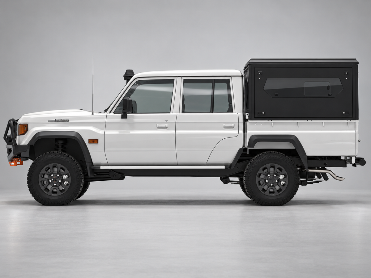 Alu-Cab ModCAP base with flat roof on a Toyota Land Cruiser 79 double cab, glass side windows
