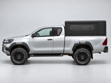 Alu-Cab ModCAP base with flat roof on a Toyota Hilux extra cab, glass side windows