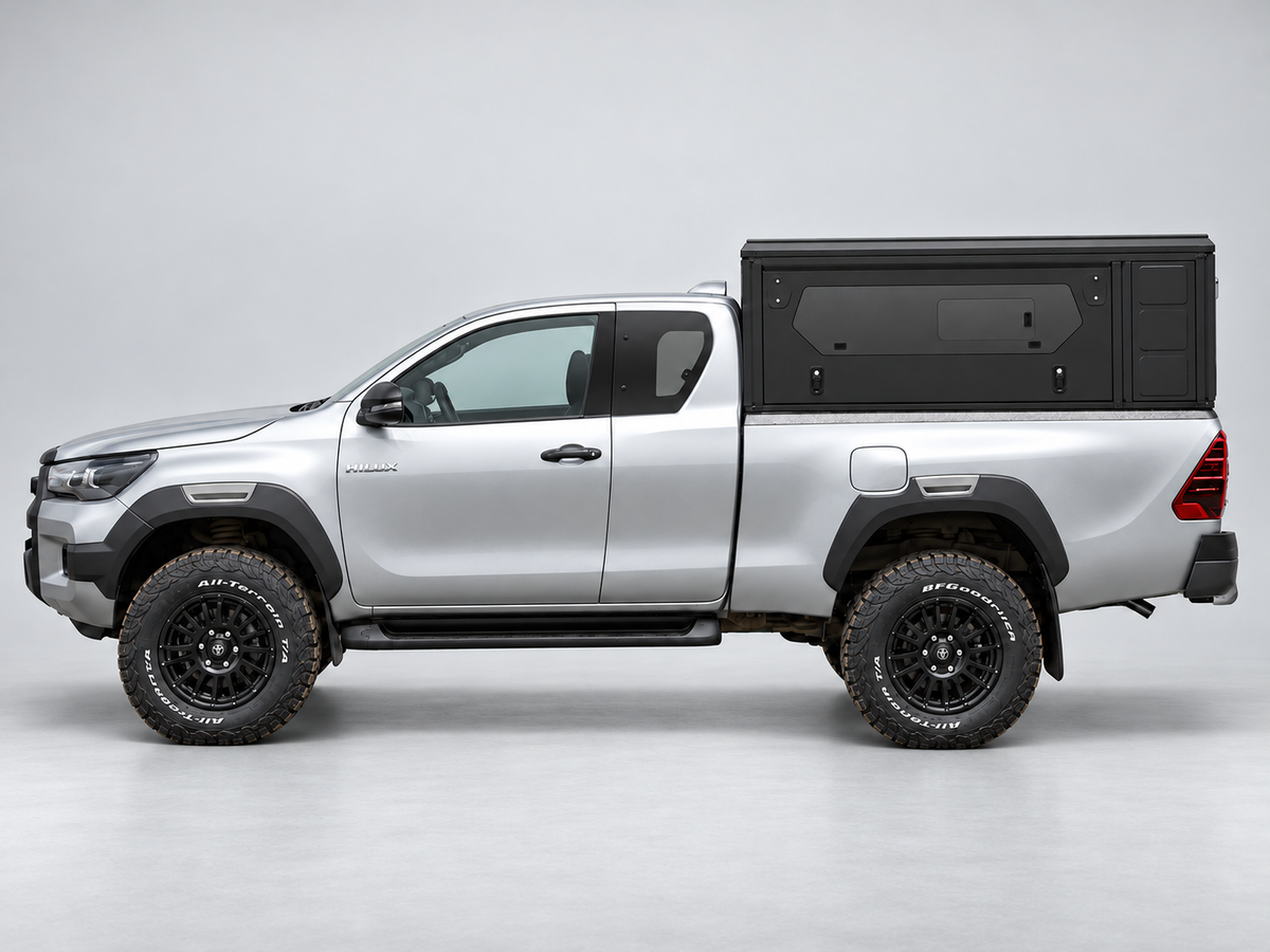 Alu-Cab ModCAP base with flat roof on a Toyota Hilux extra cab, glass side windows