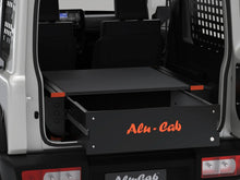 Alu-Cab Jimny Drawer System pulled open in a Suzuki Jimny 3-door, render