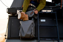 Alu-Cab Shoe / Mud Bag on a canopy camper ladder, boots going into the bag