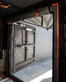 Alu-Cab rear mozzie/midge net fitted across the rear opening, canvas rolled up, rear door open