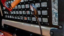 Alu-Cab rear door molle plate on a Land Cruiser 76 with a gooseneck light fitted