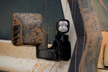 Alu-Cab mirror extension with spotlight on a muddy INEOS Grenadier